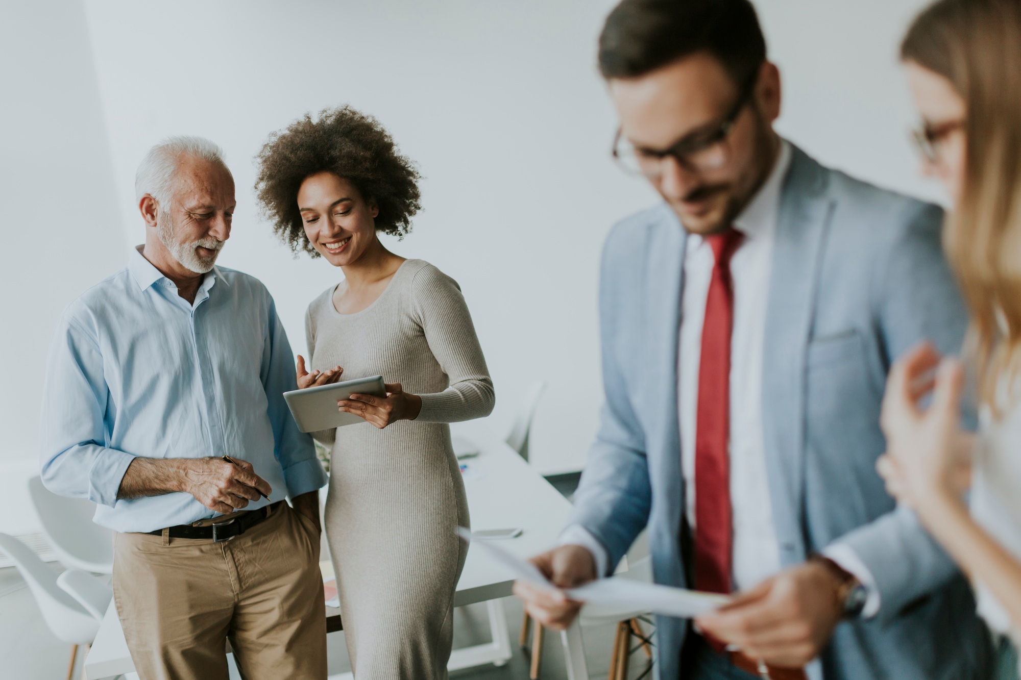 Image of business partners discussing documents and ideas