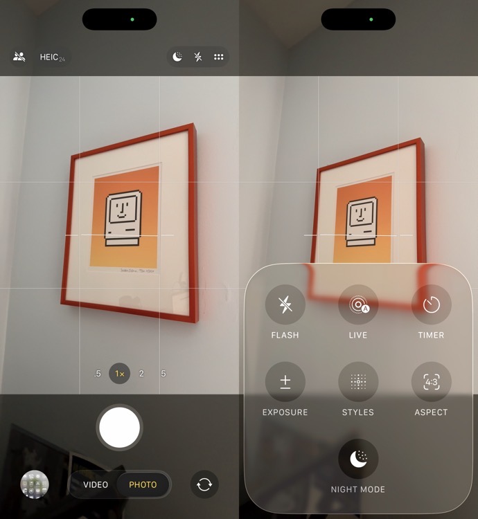 Screenshot of a smartphone camera interface with a photo of a framed picture of a computer. The interface shows options for flash, live, timer, exposure, styles, aspect ratio, and night mode.