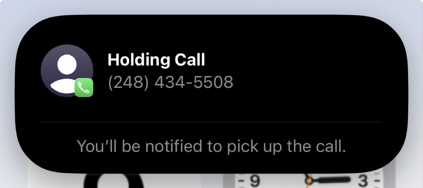 A smartphone screen shows a notification for a call from (248) 434-5508. The notification states, 'You'll be notified to pick up the call.'