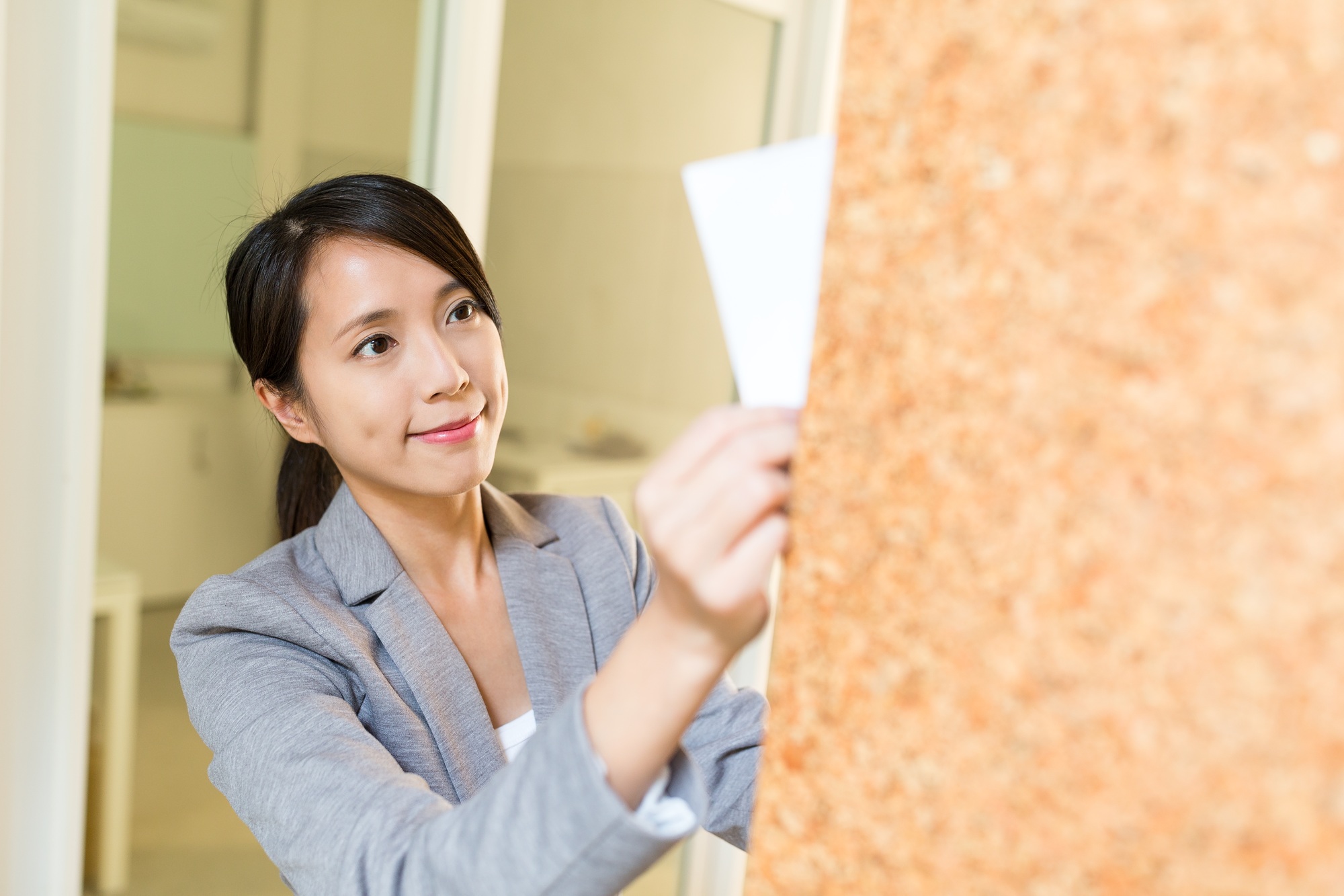 Businesswoman holding document on board