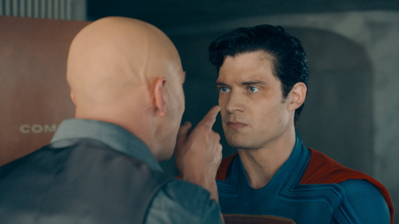 Nicholas Hoult as Lex Luthor putting his finger in the face of David Corenswet as Superman in Superman