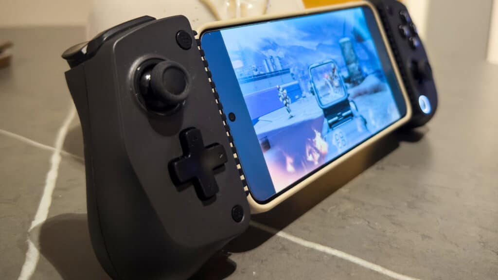 Player aims at enemies in Destiny: Rising using a GameSir X5s controller attached to a smartphone