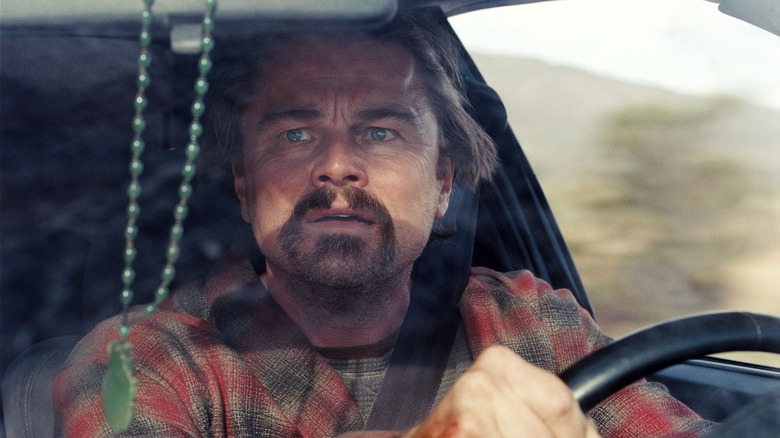 Bob frantically driving a car looking for Willa in One Battle After Another